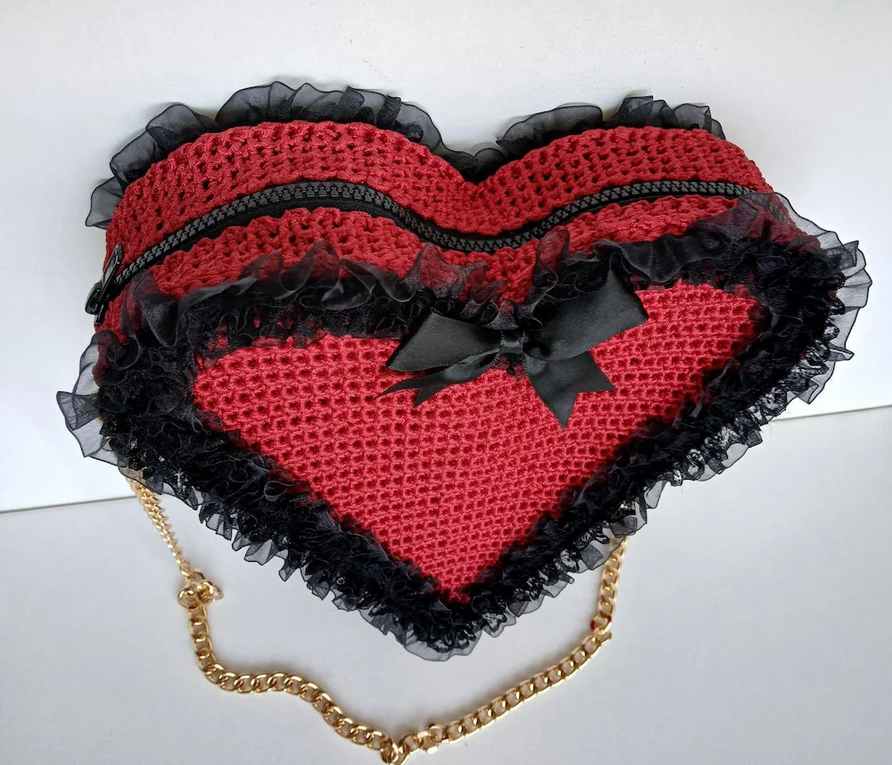 Poison Cherry Heart Bag — flat lay top view showing black zipper, black satin bow, black lace ruffle trim and gold chain strap - Victorian Velvet
