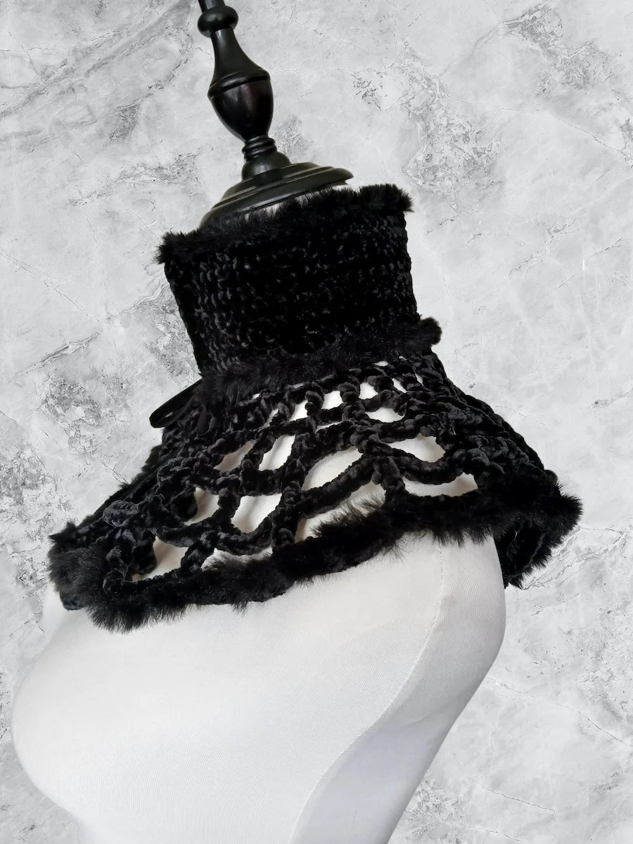 Side view of black fluffy velvet spiderweb crochet collar on mannequin bust showing high neck and open mesh pattern, grey marble background - Victorian Velvet