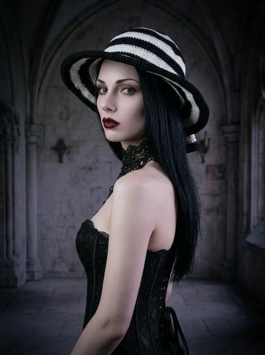 Side view of handmade black and white striped crochet hat on gothic model in black corset, Victorian aesthetic - Victorian Velvet