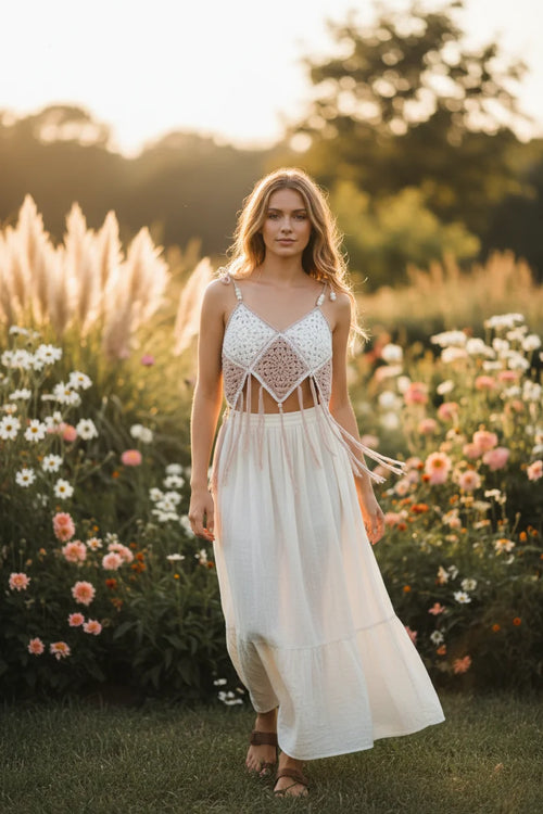 Beige and white crochet granny square crop top — close up detail of handmade crochet pattern, long beige fringe tassels and adjustable beaded straps on model - Victorian Velvet