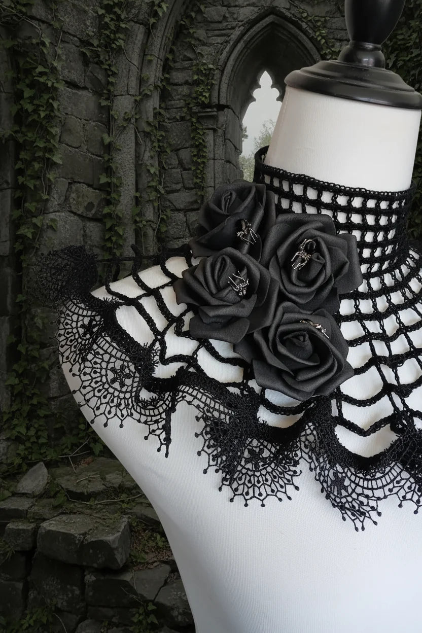 Close-up detail of black satin roses on a gothic crochet spider web collar in stone ruins - Victorian Velvet
