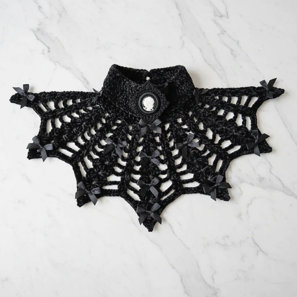 Gothic Collar — Portrait of a Lady, flat lay on white marble showing full spiderweb crochet pattern with cameo brooch and satin bows - Victorian Velvet