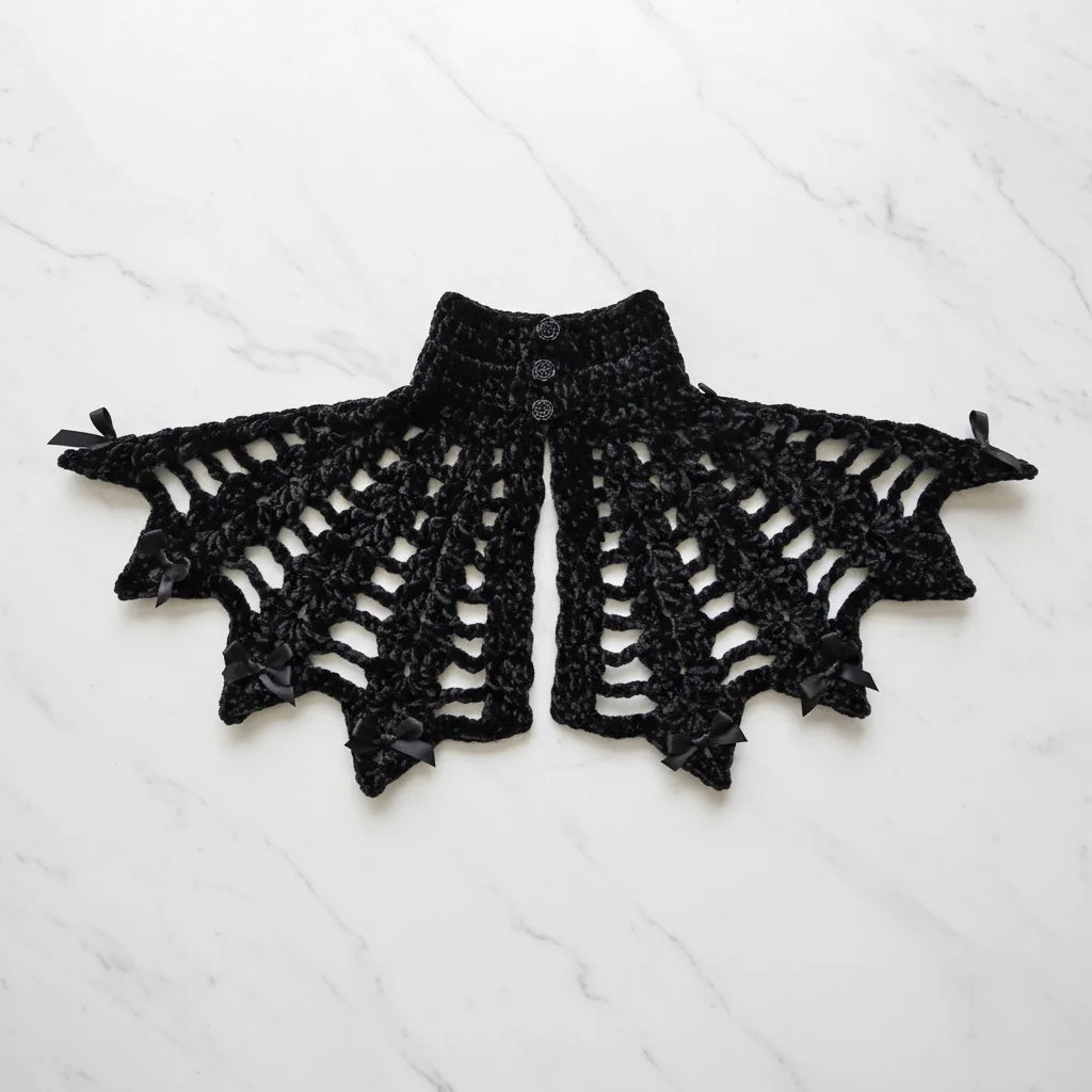 Gothic Collar — Portrait of a Lady, back view flat lay on white marble, showing three small black rose-shaped buttons closure and spiderweb crochet pattern with satin bows - Victorian Velvet