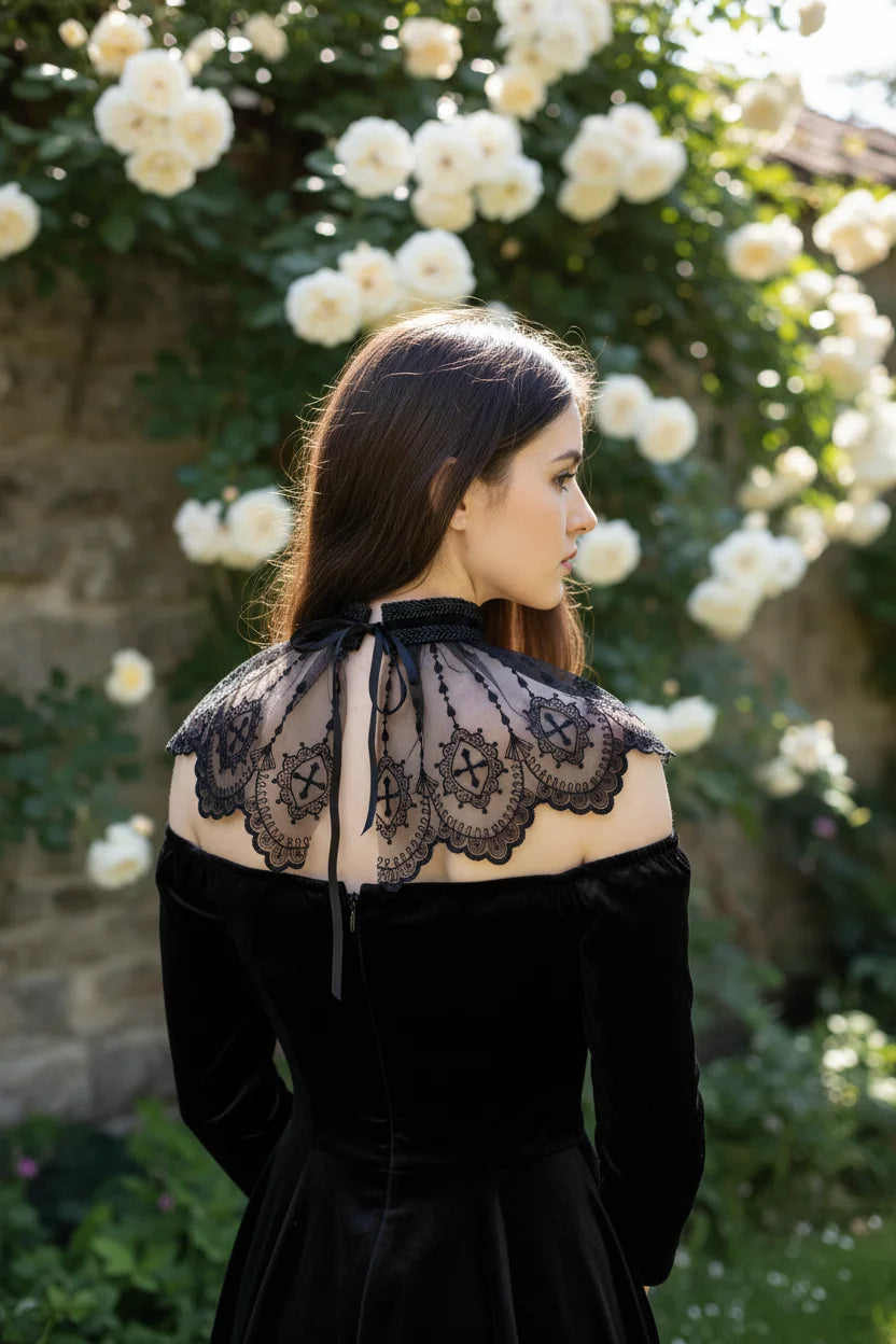 Back view of gothic lace cross collar with butterfly wing shape and black ribbon tie, dark-haired woman in black velvet dress, white rose garden - Victorian Velvet