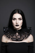 The Shadow Bloom Gothic Vampire Collar worn by a pale woman with dark hair and red lips, front view, dark background - Victorian Velvet