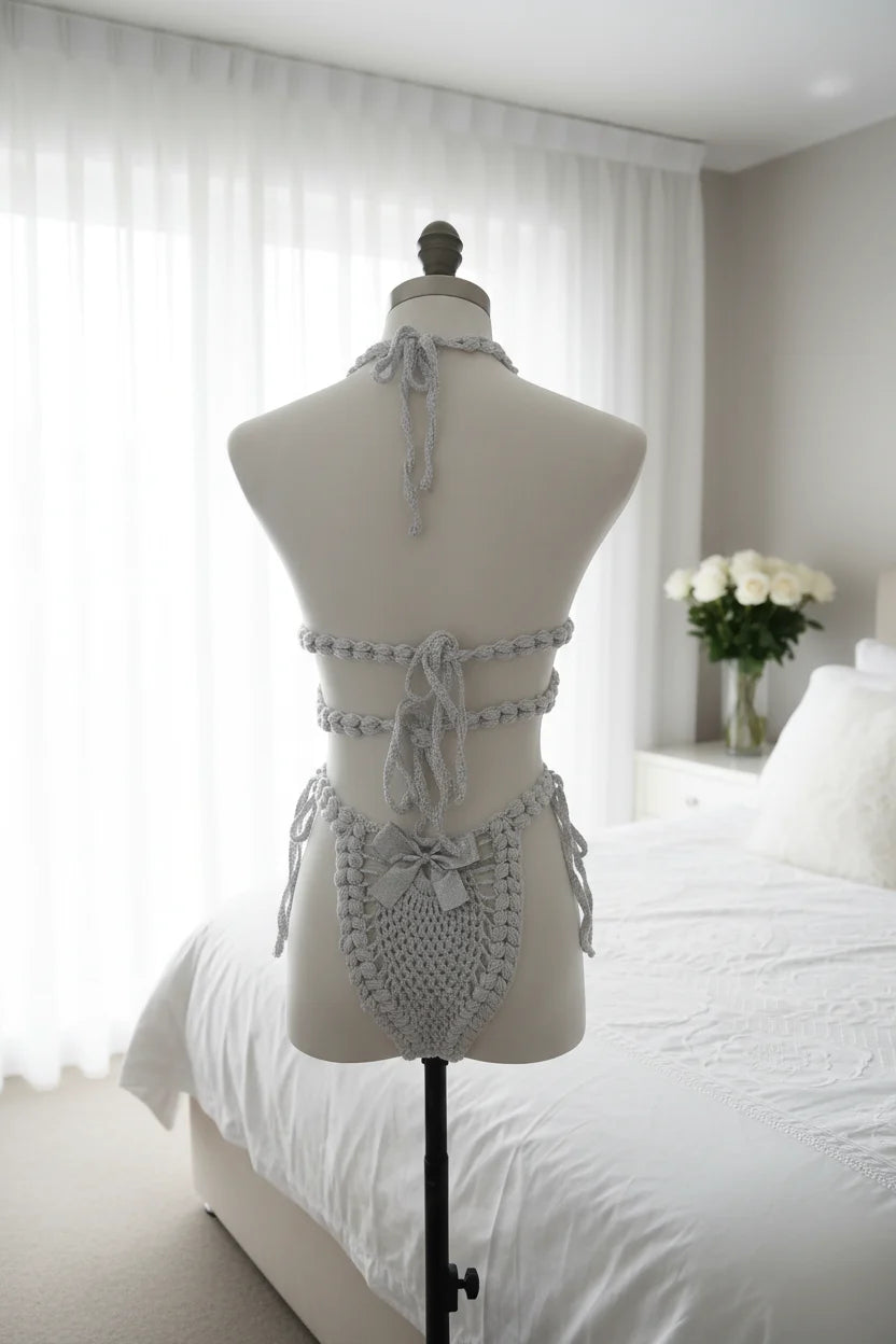 Handmade silver grey crochet lingerie set with silver satin bows, back view on dress form mannequin, bright bedroom with white roses in vase - Victorian Velvet