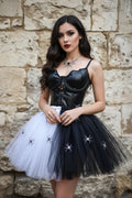 Black and white two-tone tulle skirt with spider decorations, worn with black faux leather corset top, front view, gothic fashion editorial, Victorian Velvet
