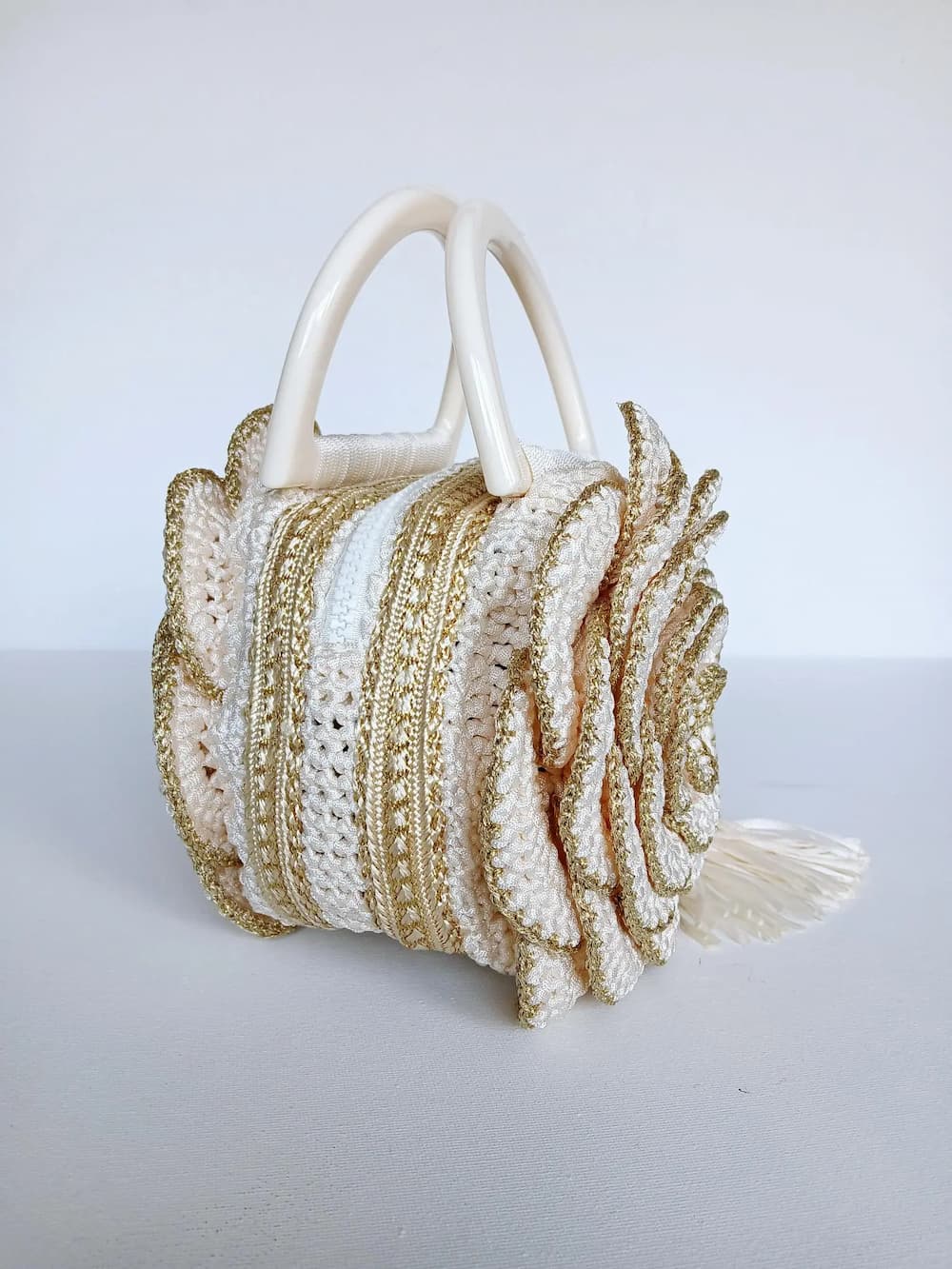 Versailles Rose handmade crochet rose handbag back view showing gold and cream crochet stripes with ivory round handles — Victorian Velvet