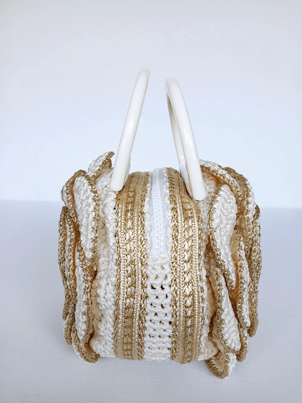 Versailles Rose handmade crochet rose handbag top view showing ivory handles and gold zipper closure — Victorian Velvet