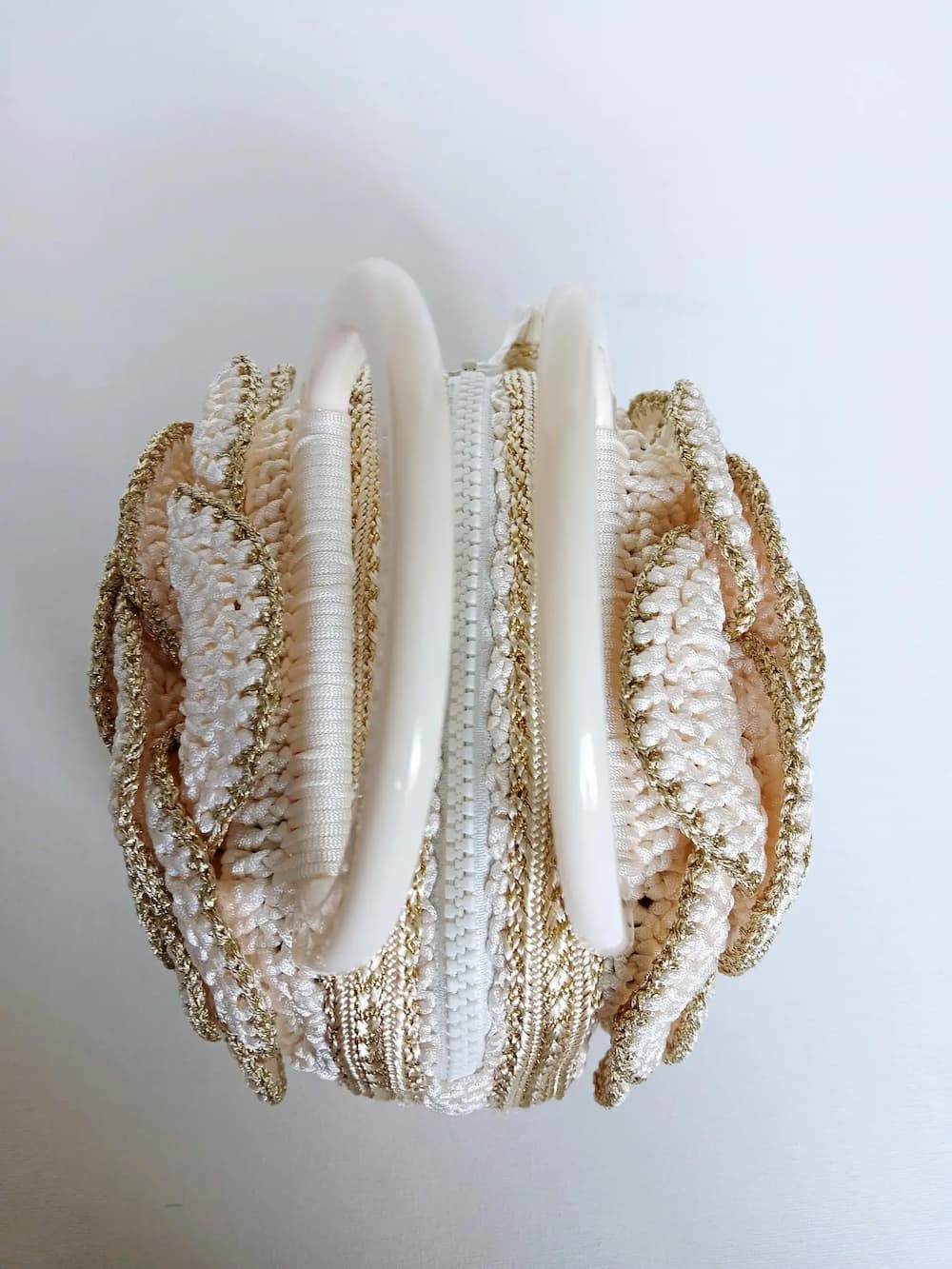 Versailles Rose handmade crochet rose handbag close up of the large spiral rose detail in cream and gold metallic yarn — Victorian Velvet