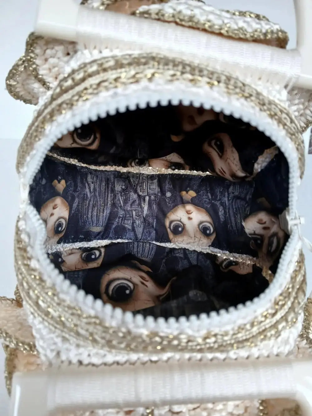 Versailles Rose handmade crochet rose handbag open zipper showing gothic dark lining with illustrated doll faces and haunted castle print — Victorian Velvet