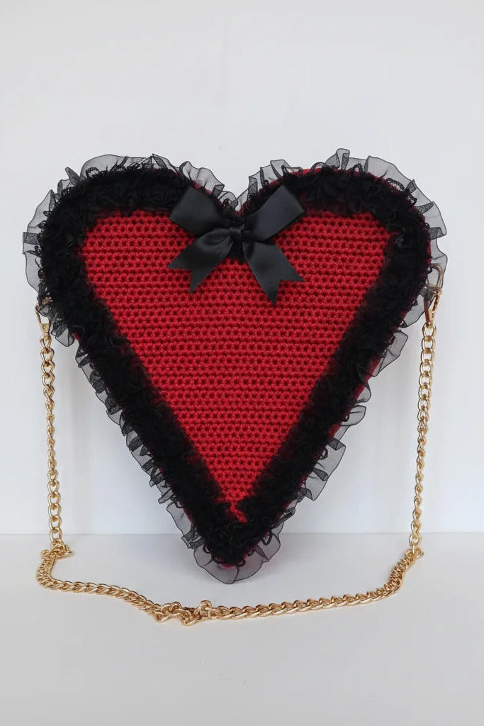 Poison Cherry Heart Bag — front view showing red crochet heart shape, black lace ruffle border, black satin bow and gold chain strap - Victorian Velvet
