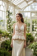 Victorian lace halter top in cream and gold crochet worn by a model in a romantic garden setting, front view - Victorian Velvet