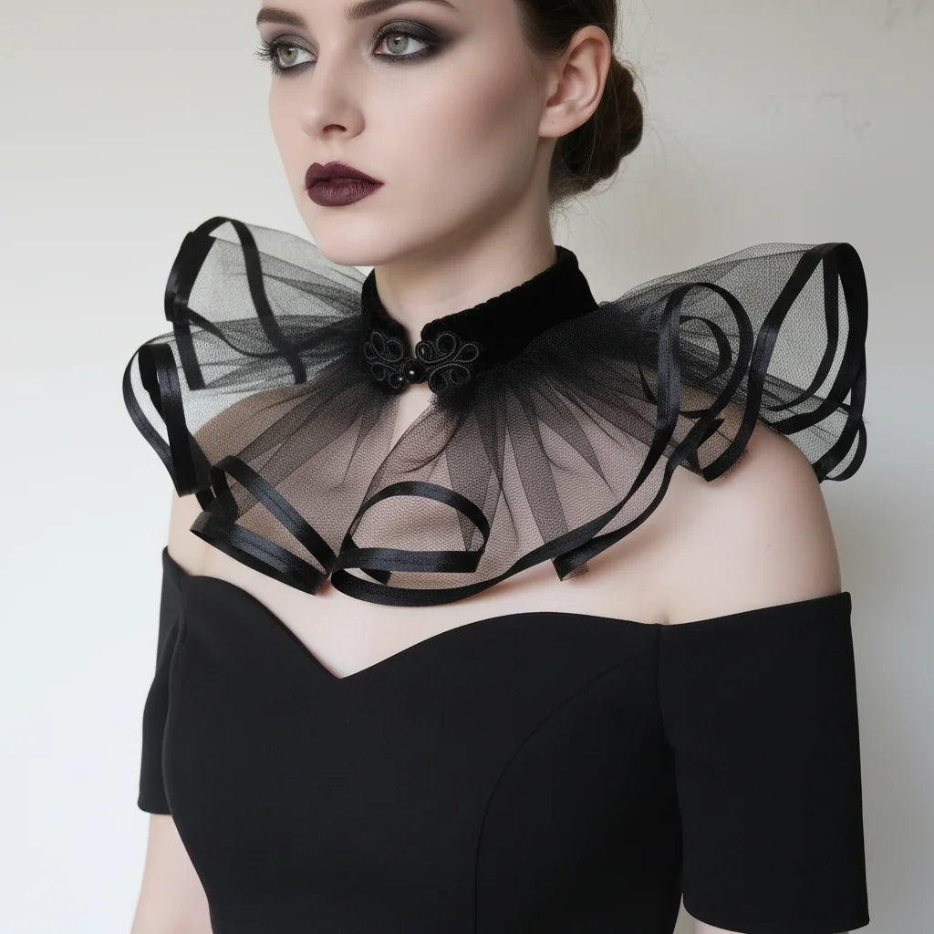 The Shadow Bloom gothic tulle collar with black satin ribbon loops and velvet neckband with frog closure, worn by a pale woman with dark smoky eyes and burgundy lips, off-shoulder black dress, white background — Victorian Velvet